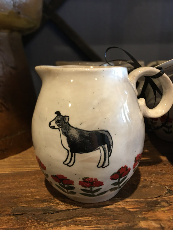 CREAMER STONE WARE WITH DOG & FLOWER MOTIF